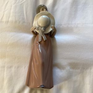 Lladro Porcelain’s Lladro “Bashful Girl with Hat Figurine